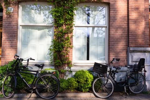 Bicycles on empty streets of Amsterdam Stock Photos
