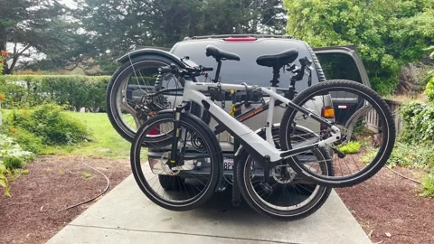 Bicycles mounted on a car, ready to be transported. Stock Footage 254031402