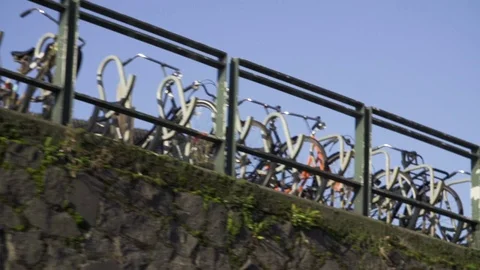 Bicycles parked on bridge Stock Footage 71535843