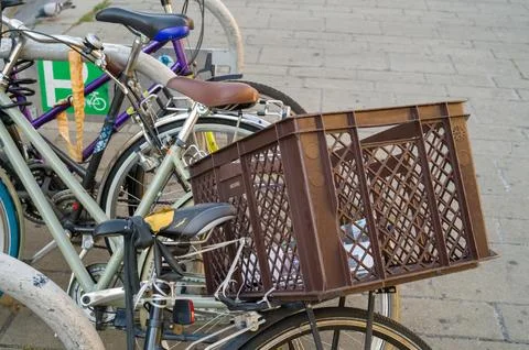 Bicycles parked with a crate Фото