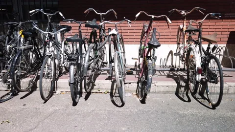 Bicycles parked on a train station platform Video stock 160364714