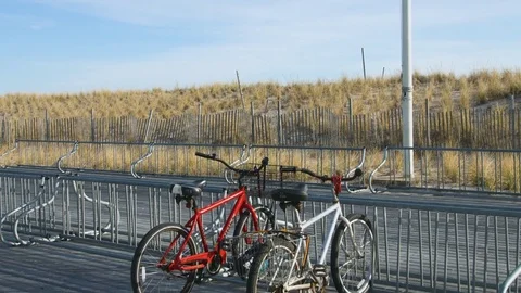 Bicycles resting on rack Stock Footage 75172741
