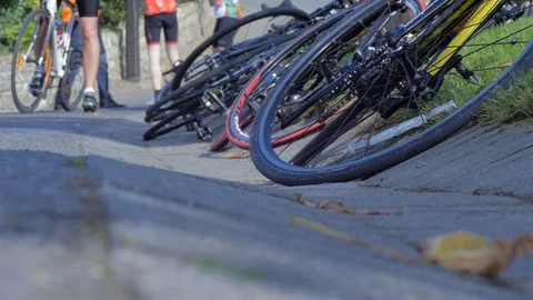 Bicycles Stacked by the Roadside Stock Footage 97871390