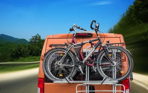 Bicycles on the trunk of a minivan Stock Photos