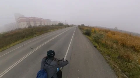 Bicycling. Back view. Stockbeeldmateriaal 145129058