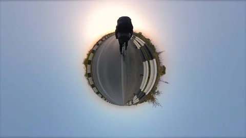 Bicycling. View of a small planet. 360 degree camera. Vidéo 145133715