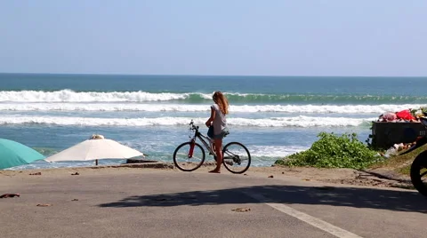Bicyclist by the Beach Stock Footage 50384429