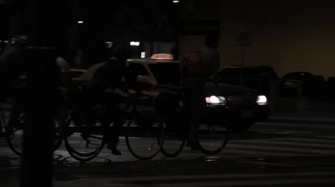 Bicyclist crossing street Stock Footage