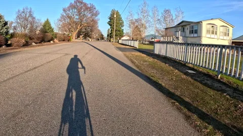 Bicyclist long shadow Video stock 274518143