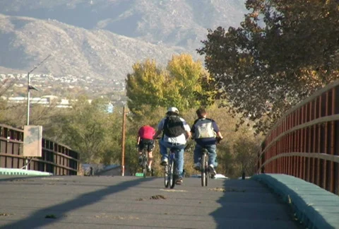 Bicyclists on a bridge Stock Footage 92374