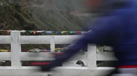 Bicyclists riding by camera on bridge 스톡 동영상 37161547