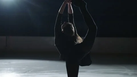 Biellmann spin in single female figure skating, young sportswoman is spinning on Video stock 150876266