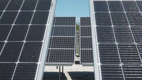Bifacial photovoltaic solar panels array at industrial renewable energy farm Stock-Footage 334443612