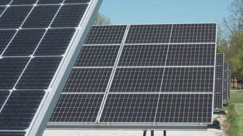 Bifacial photovoltaic solar panels array on industrial power plant farm Stock Footage 334447510