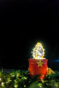Big advent light on black background Stock Photos