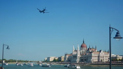 A big airplane fly over the river Danube / hungarian Parliament / Budapest Stock Footage 103169976