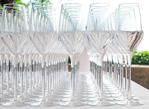 Big amount of empty champagne glasses on the table close-up Stock Photos
