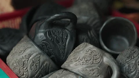 Big amount of light and dark gray cups with garnish with small details cut in Stock Footage 315661924