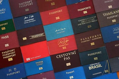 Big amount of passports of various different countries. Covers of expired Stock Photos