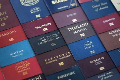 Big amount of passports of various different countries. Covers of expired Stock Photos