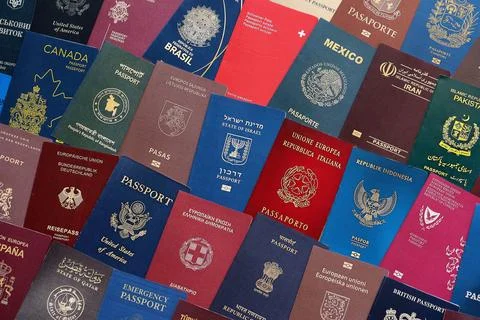 Big amount of passports of various different countries. Covers of expired Stock Photos
