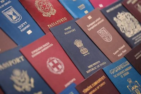 Big amount of passports of various different countries. Covers of expired Stock Photos