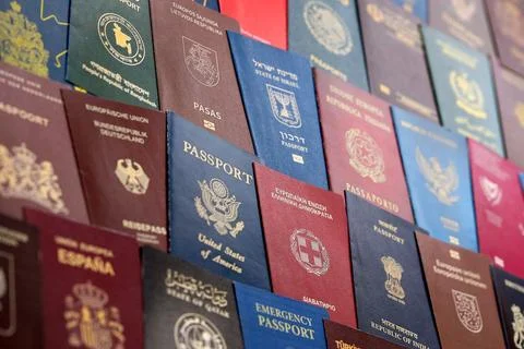 Big amount of passports of various different countries. Covers of expired Stock Photos