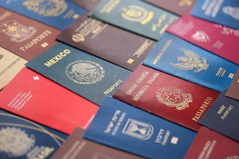 Big amount of passports of various different countries. Covers of expired Stock Photos