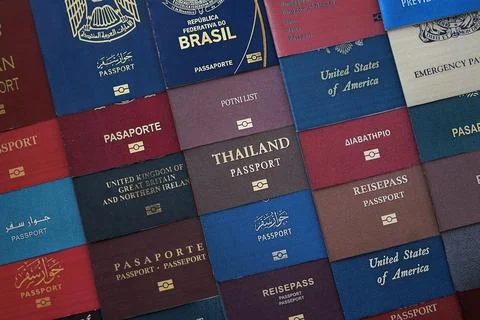 Big amount of passports of various different countries. Covers of expired Stock Photos