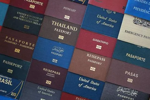 Big amount of passports of various different countries. Covers of expired Stock Photos
