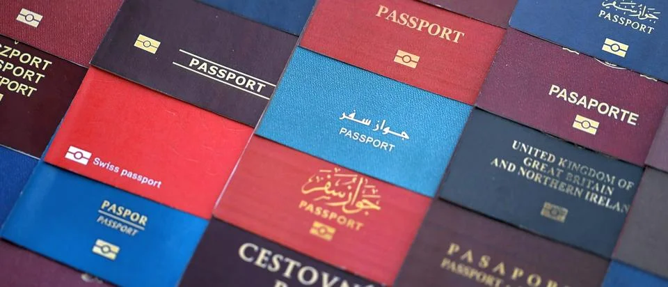 Big amount of passports of various different countries. Covers of expired Stock Photos
