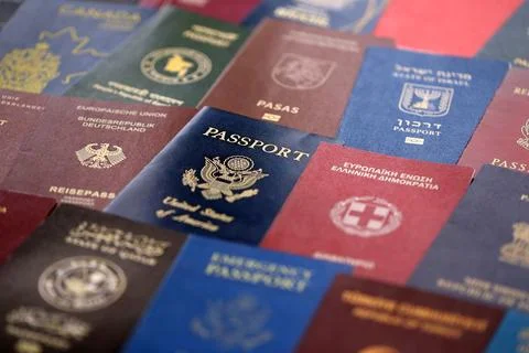 Big amount of passports of various different countries. Covers of expired Stock Photos
