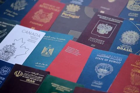 Big amount of passports of various different countries. Covers of expired Stock Photos