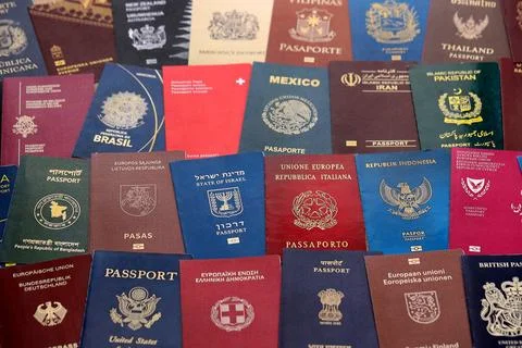 Big amount of passports of various different countries. Covers of expired Stock Photos