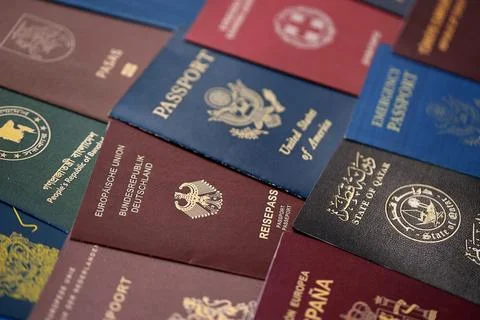Big amount of passports of various different countries. Covers of expired Stock Photos