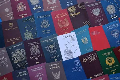 Big amount of passports of various different countries. Covers of expired Stock Photos