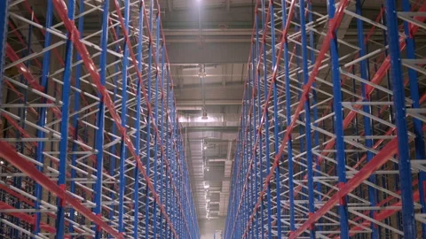 Big and modern warehouse under construction, featuring metal shelving Stock Footage 239771700