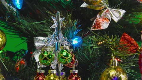 Big and small Christmas trees on a green background Stock Footage 144666763