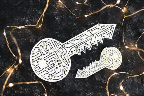 Big and small encryption key icon made of circuits and LED lights on dark bac Foto stock