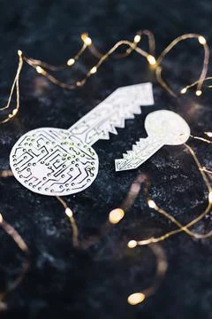Big and small encryption key icon made of circuits and LED lights on dark bac Foto stock