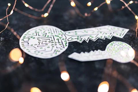 Big and small encryption key icon made of circuits and LED lights on dark bac Foto stock