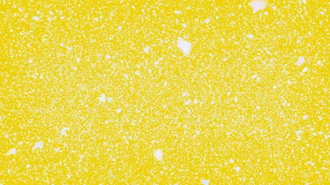 Big and small snowflakes fall down. Yellow background Stock Footage 120818743
