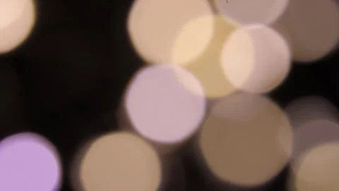 Big and small two-colored lights move in the darkness. 스톡 동영상 317482663