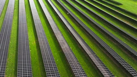 Big Array Of Solar Panels Over Green Farm Fields. Aerial Drone Shot Stock Footage 309166300