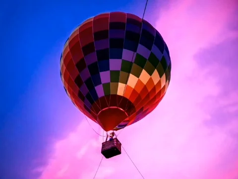 Big balloon in the sunset sky. Stock Footage 109296389