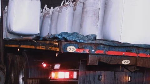 Big Bang sacks are loaded into trucks Stock Footage 122223441