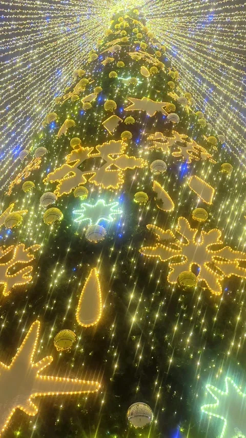Big beautiful Christmas tree with decorations and Illuminations in night. Stock Footage 293846642