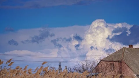 Big beautiful clouds behind the house in crimea Stock Footage 105349159