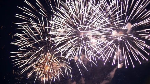 Big beautiful exploding firework in the dark sky. Lots of bright colored lights. Stock Footage 107925946