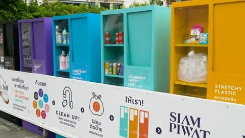 Big beautiful waste sorting recycle collection bins on the street in Bangkok Stock Footage 161955224